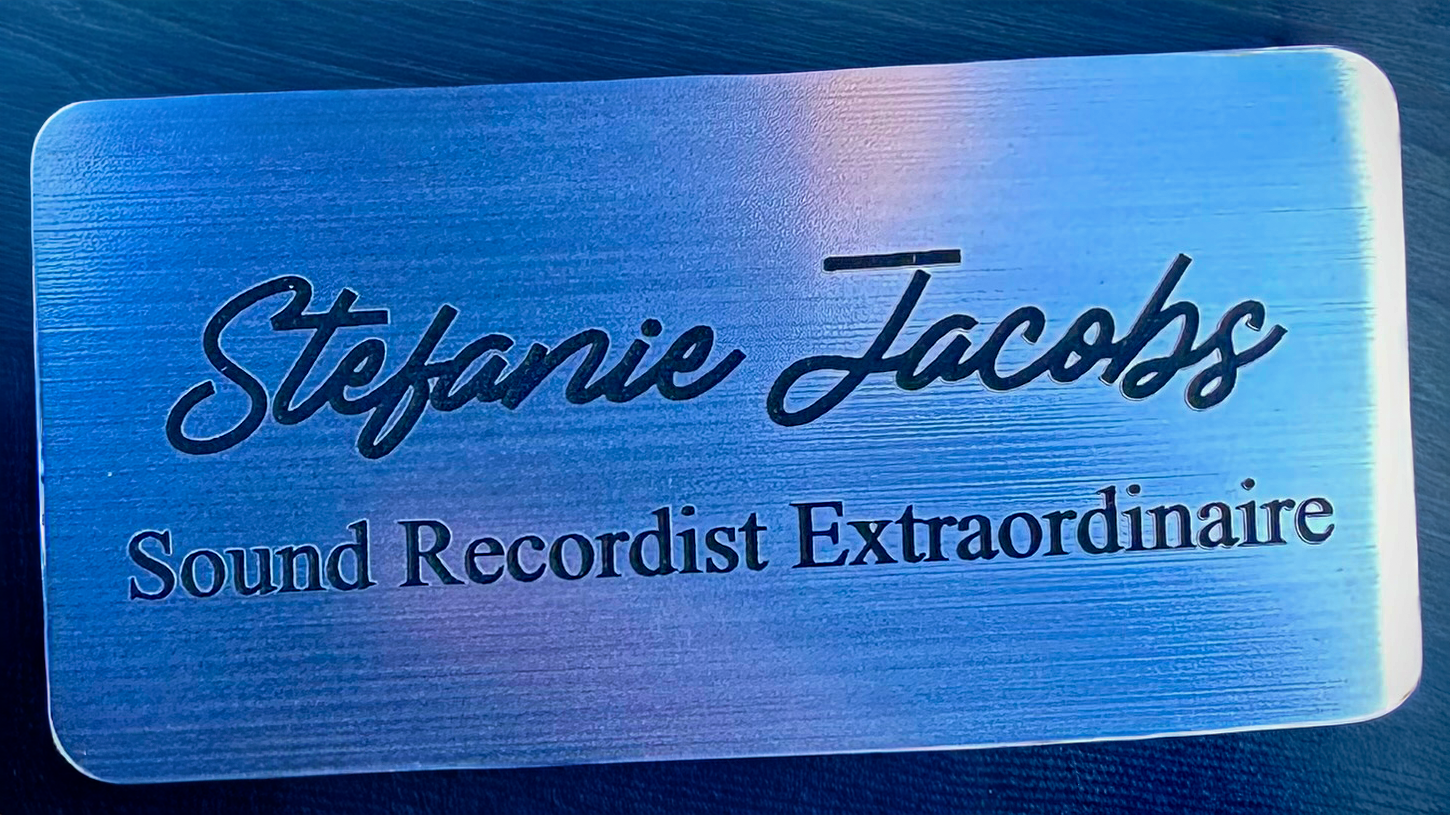 A custom film set name tag for Stefanie Jacobs with the title Sound Recordist Extraordinaire.
