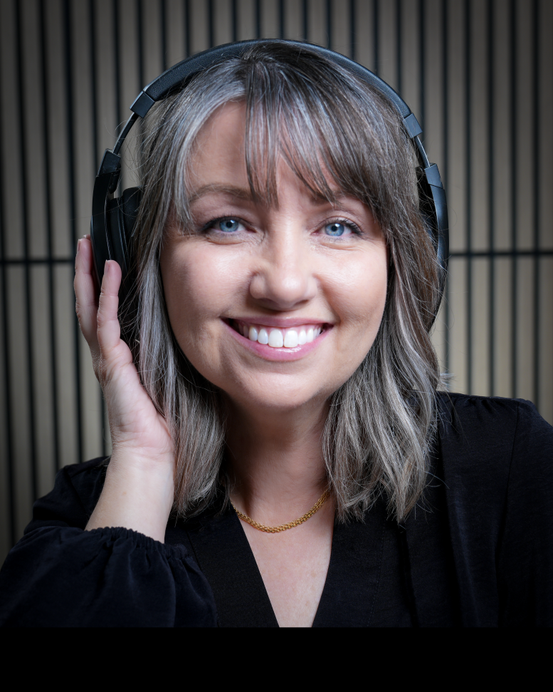 Professional media creator at Jacobs Ladder Media wearing headphones, ready to provide audio, video, and digital services.